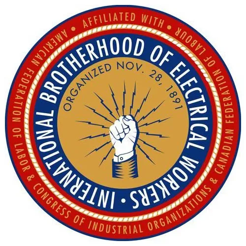 Tan circle with solidarity fist surrounded by lightning bolts surrounded by a blue circle with the white words "International Brotherhood of Electrical Workers." This is surrounded by a red circle with the white words "Affiliated with AFL-CIO and Canadian Federation of Labour."